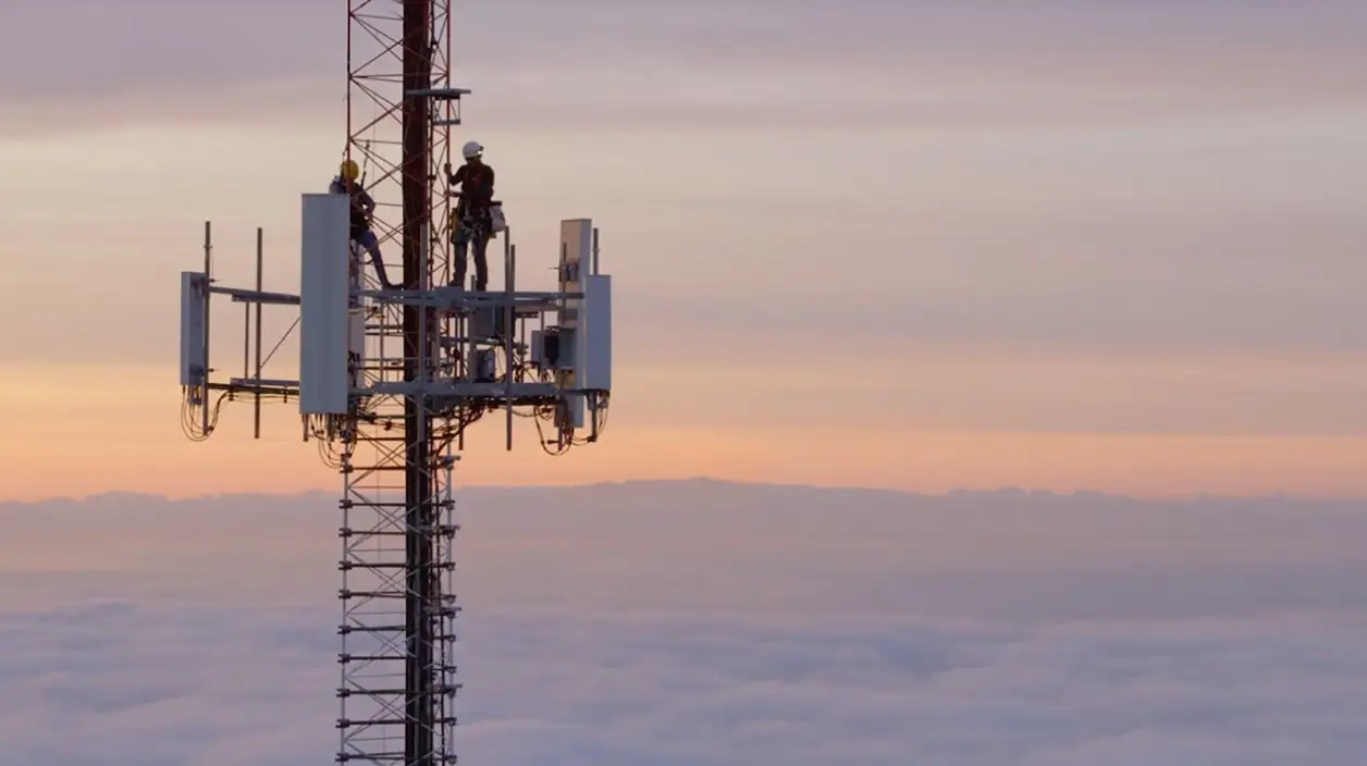 People working on a cell tower